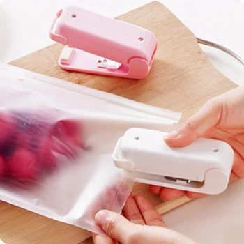 Yeni taşınabilir Mini torba ısı yapıştırma makinesi Capper kapsülleme aperatif yiyecek plastik küçük ev el basınçlı ısı yapıştırma